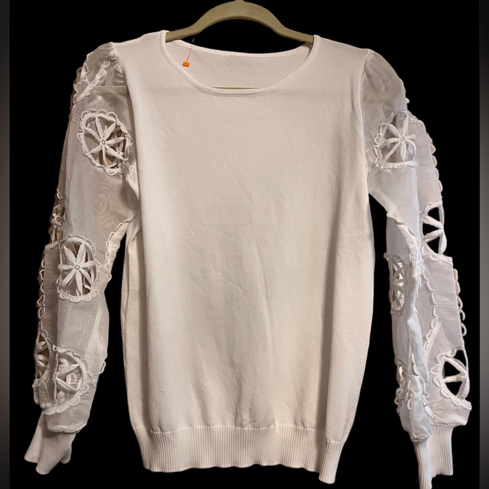Knit and sheer cut out sweater.
